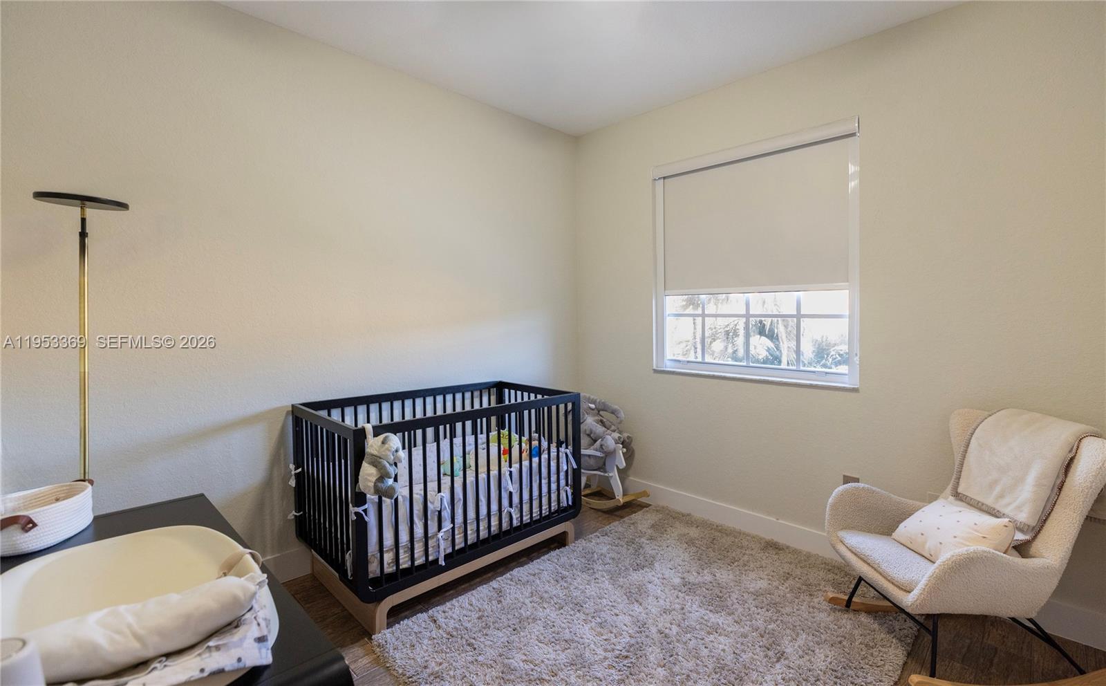 13276 Southwest 128th Street Miami, FL 33186 - Photo 10 of 43 a view of a bedroom with furniture and a window