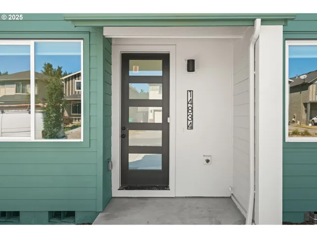 a view of a door and a window