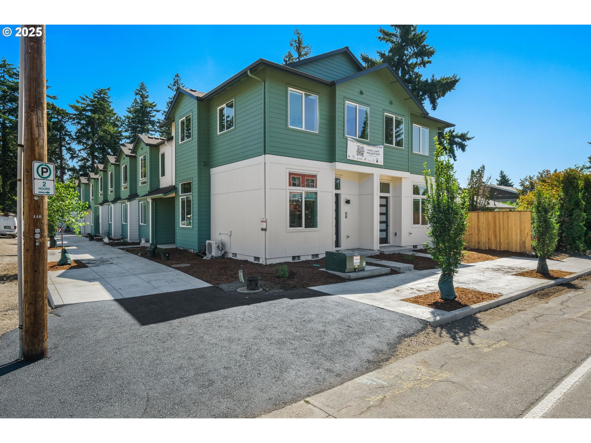 14834 Northeast Couch Street, Unit 6 Portland, OR 97230 - Photo 41 of 42 a front view of a house with street