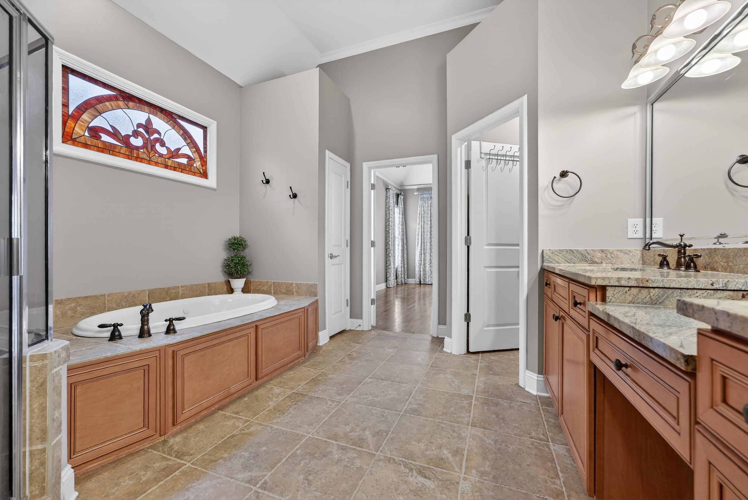1944 Laurel Lane Collierville, TN 38139 - Photo 16 of 30 a large spacious bathroom with a granite countertop tub sink and mirror
