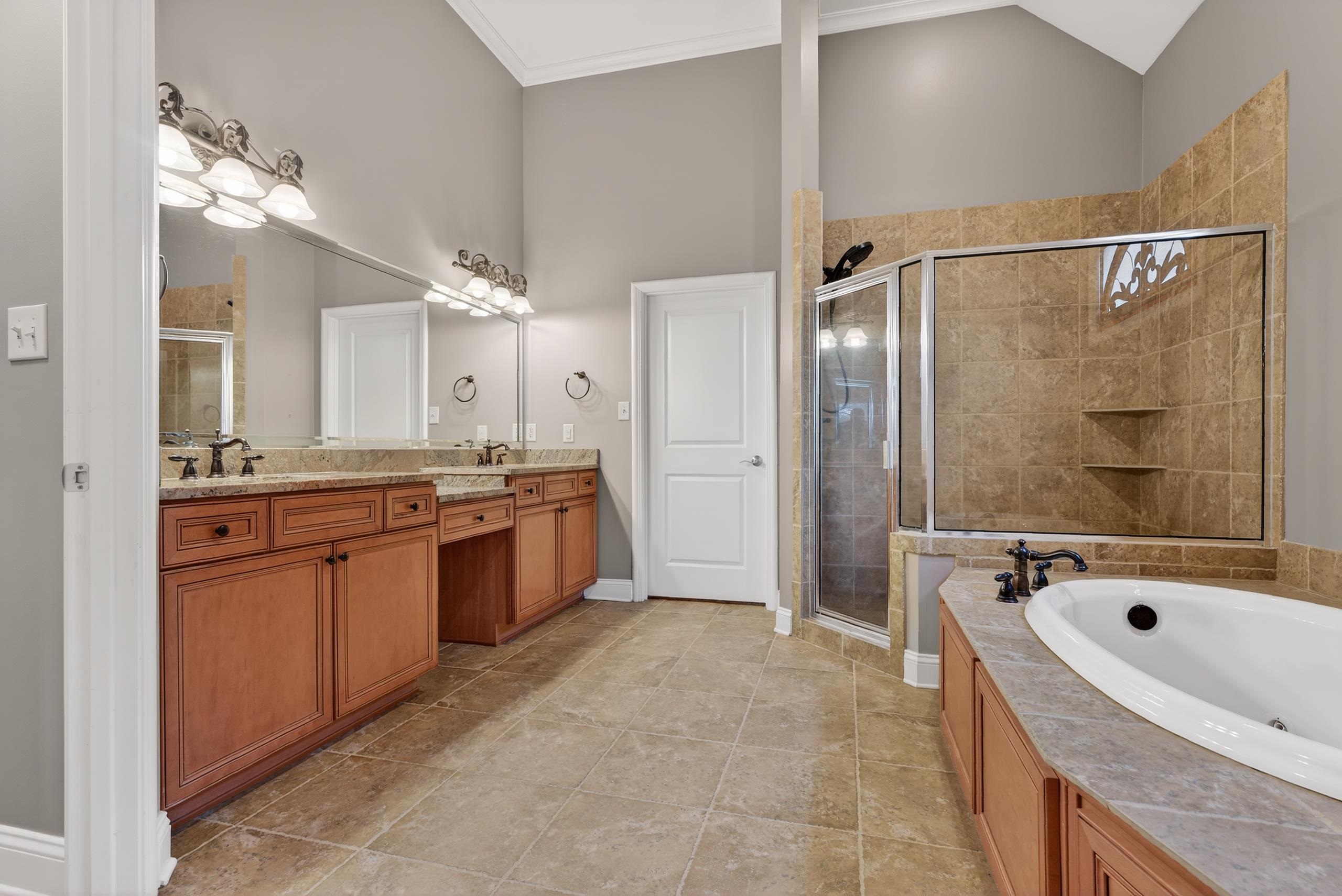 1944 Laurel Lane Collierville, TN 38139 - Photo 17 of 30 a bathroom with a granite countertop sink a bathtub and a mirror