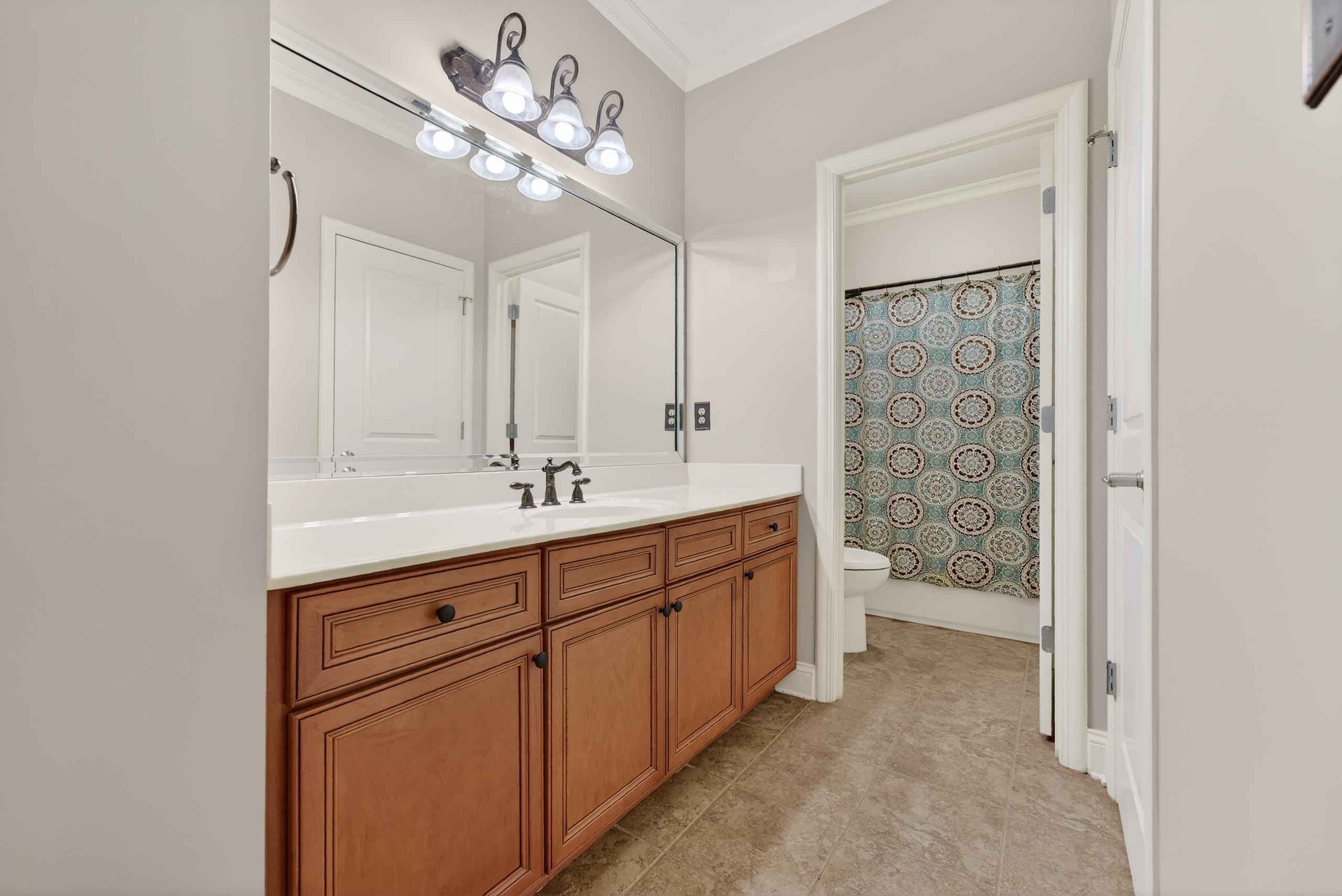 1944 Laurel Lane Collierville, TN 38139 - Photo 20 of 30 a spacious bathroom with a double vanity sink a large mirror and a shower