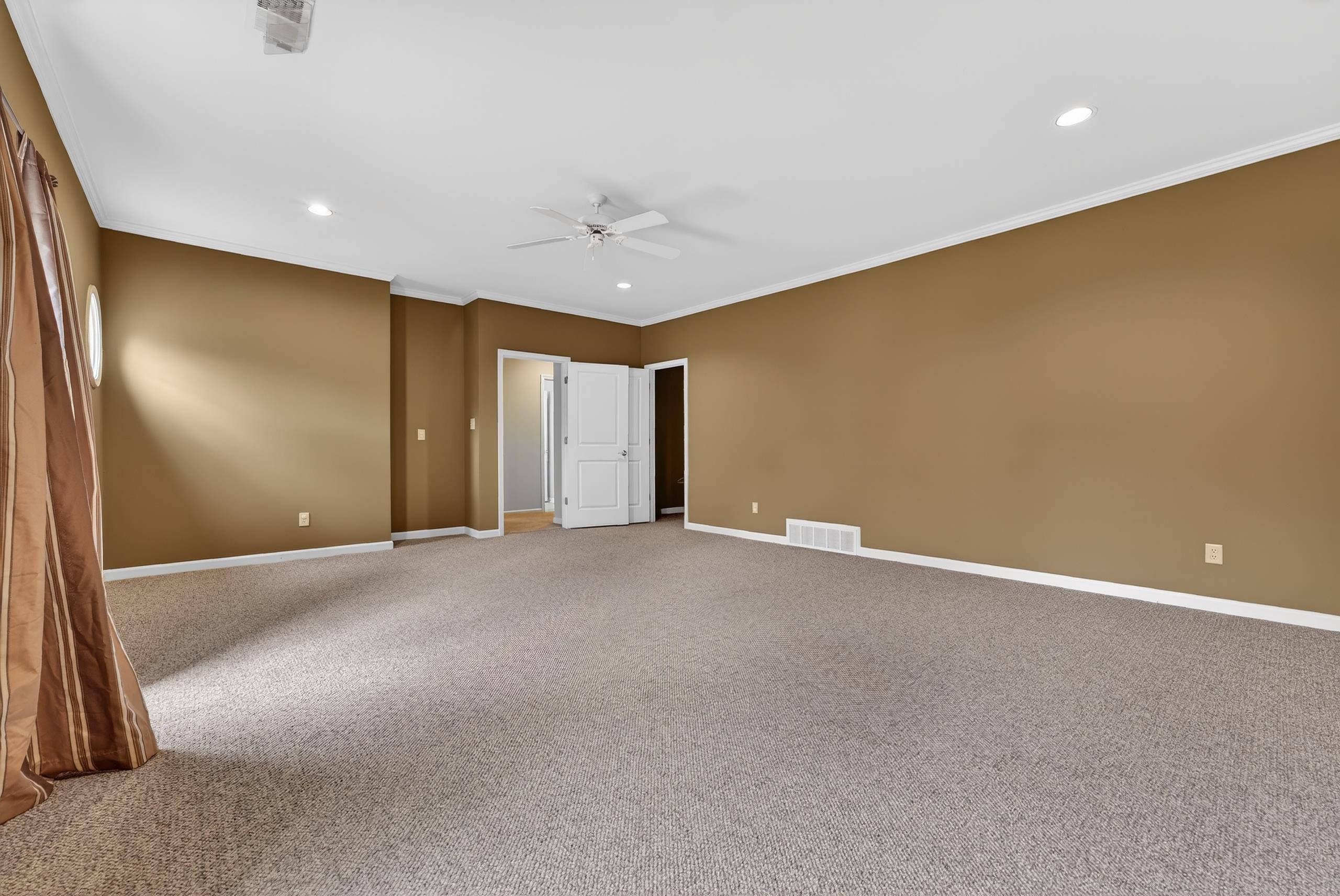 1944 Laurel Lane Collierville, TN 38139 - Photo 21 of 30 a view of an empty room with a ceiling fan