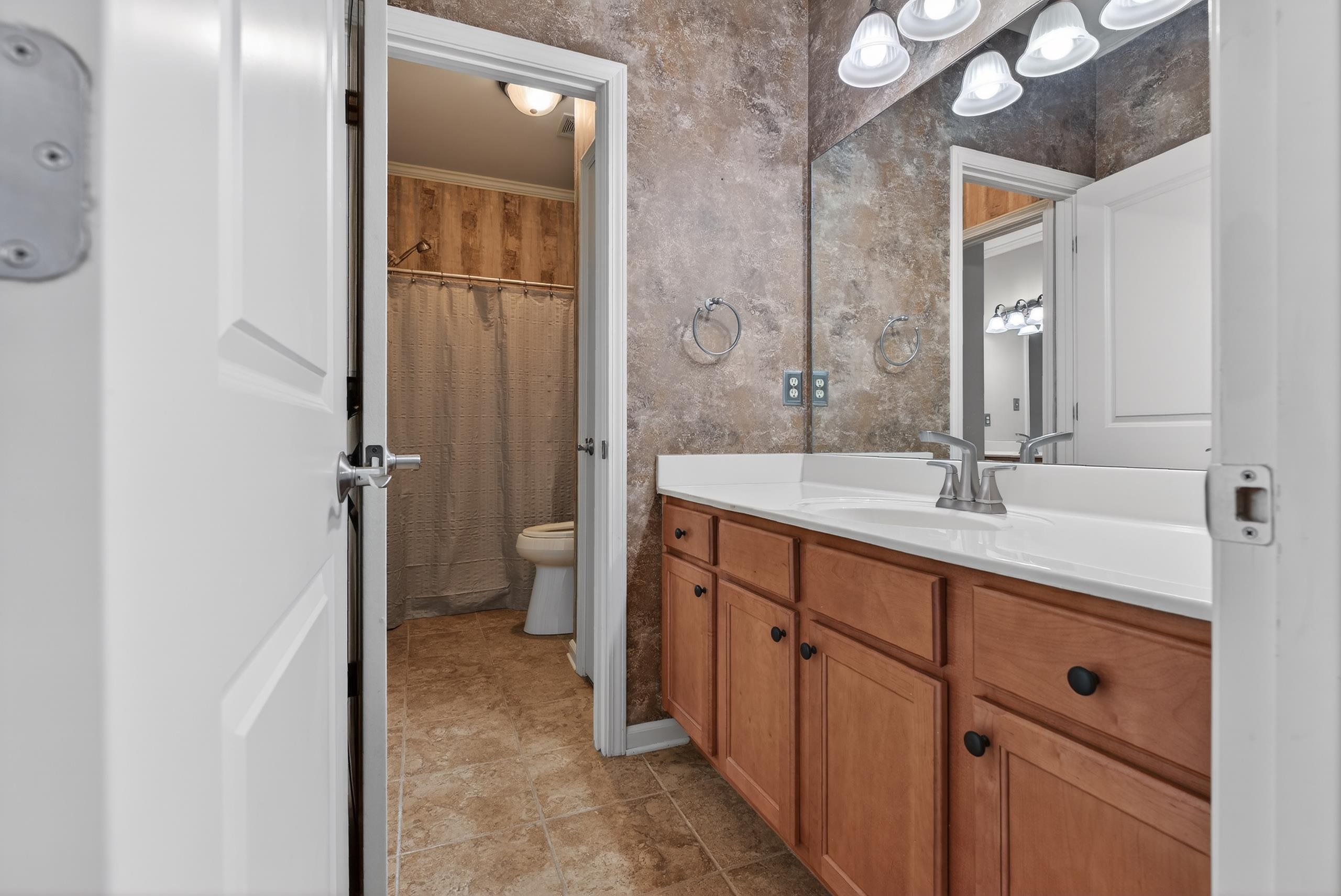 1944 Laurel Lane Collierville, TN 38139 - Photo 25 of 30 a spacious bathroom with a double vanity sink toilet and shower