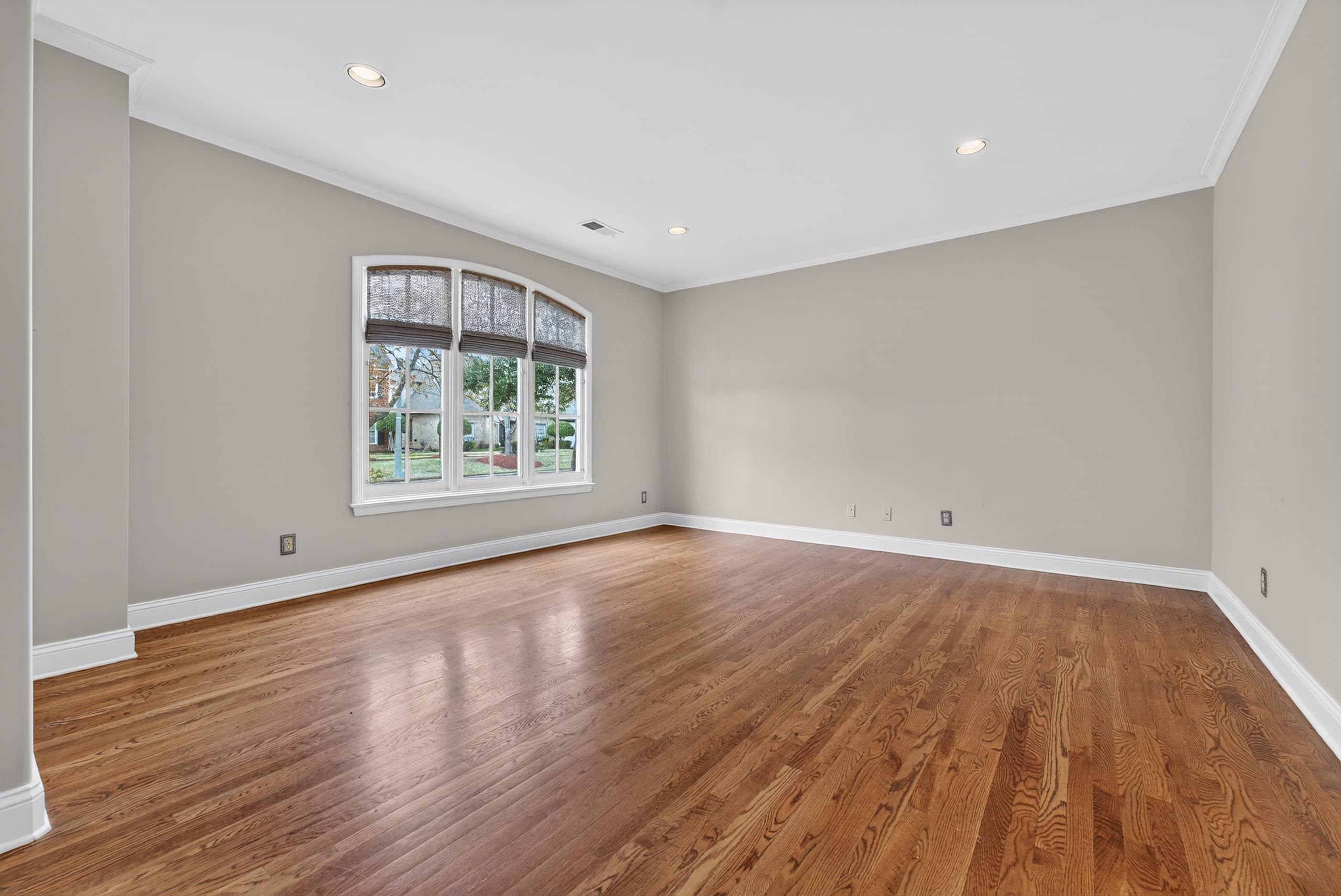 1944 Laurel Lane Collierville, TN 38139 - Photo 6 of 30 wooden floor in an empty room with a window