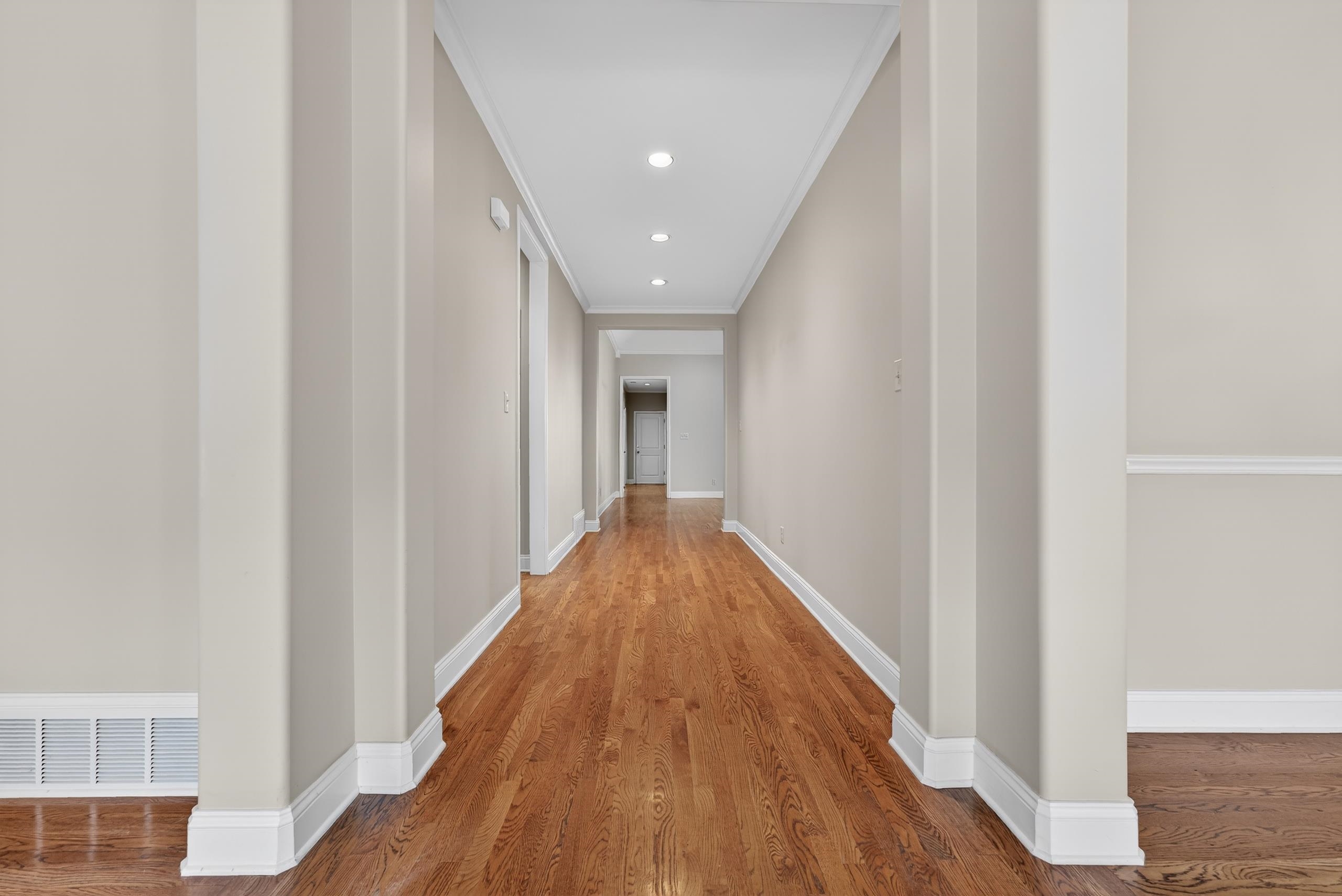 1944 Laurel Lane Collierville, TN 38139 - Photo 7 of 30 a view of a hallway with wooden floor and staircase