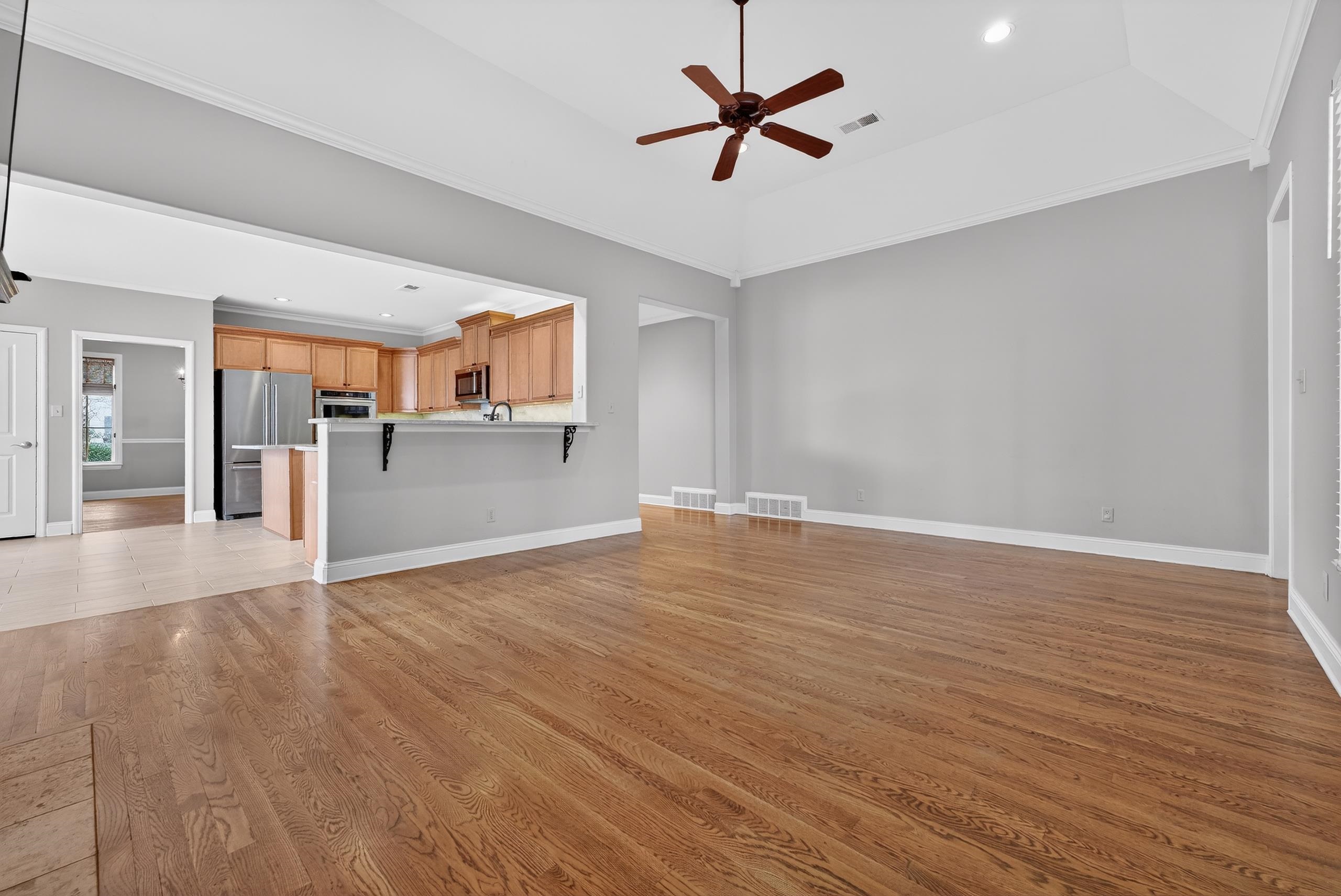 1944 Laurel Lane Collierville, TN 38139 - Photo 10 of 30 a view of a kitchen with a dishwasher cabinets and wooden floor