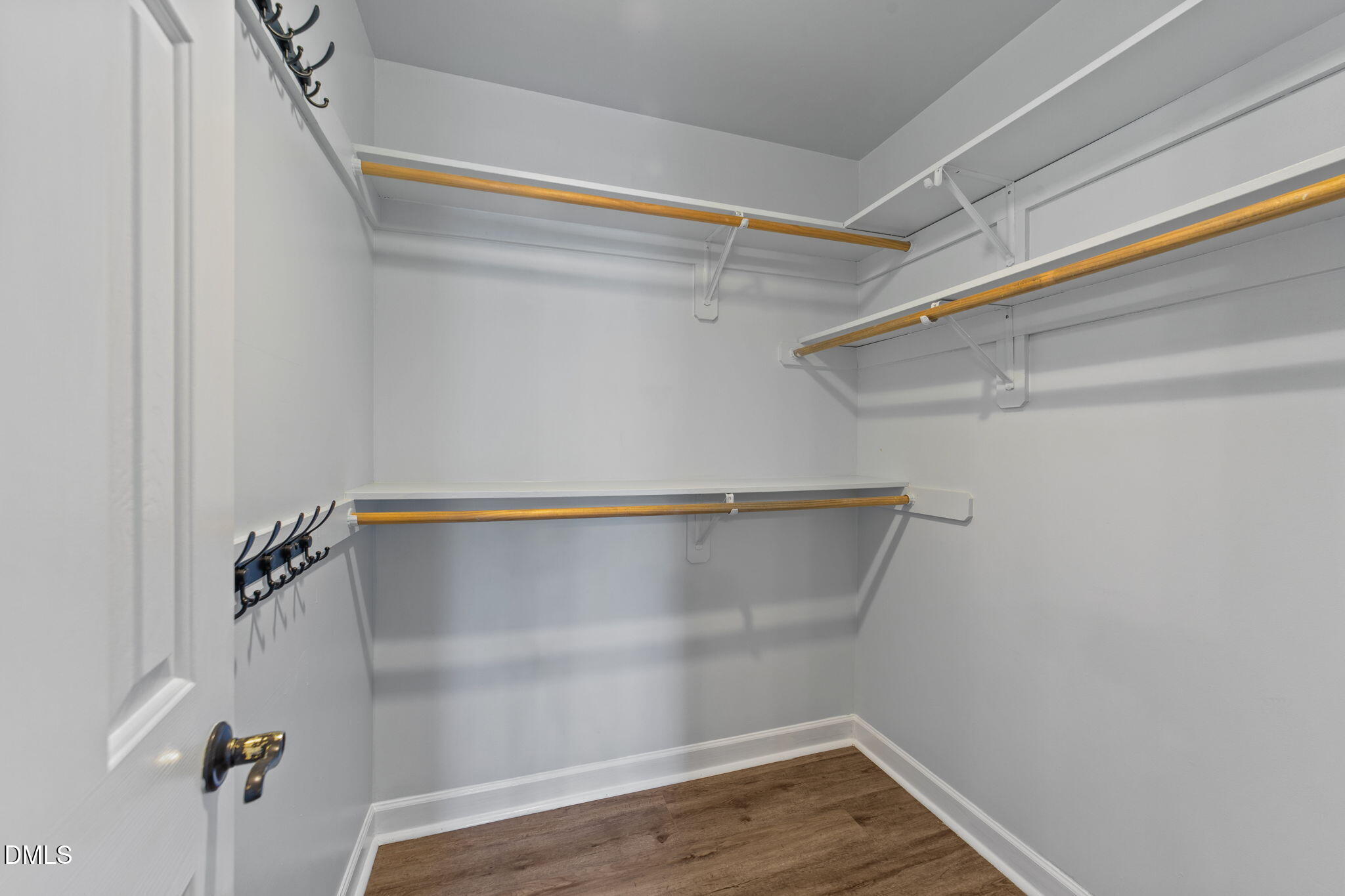 6820 Oviedo Drive Raleigh, NC 27603 - Photo 27 of 50 a view of walk in closet with empty racks