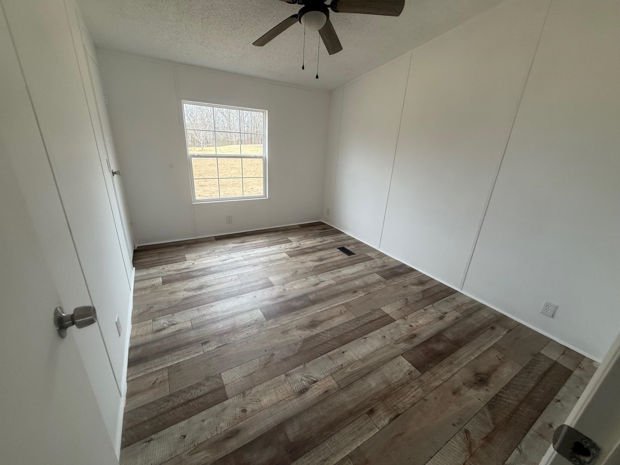 1688 Hardin Graveyard Road Adamsville, TN 38310 - Photo 17 of 40 a view of an empty room with a window