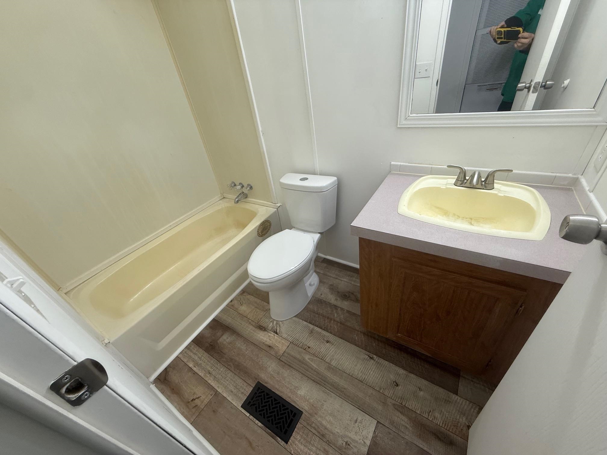 1688 Hardin Graveyard Road Adamsville, TN 38310 - Photo 18 of 40 a bathroom with a sink and a mirror