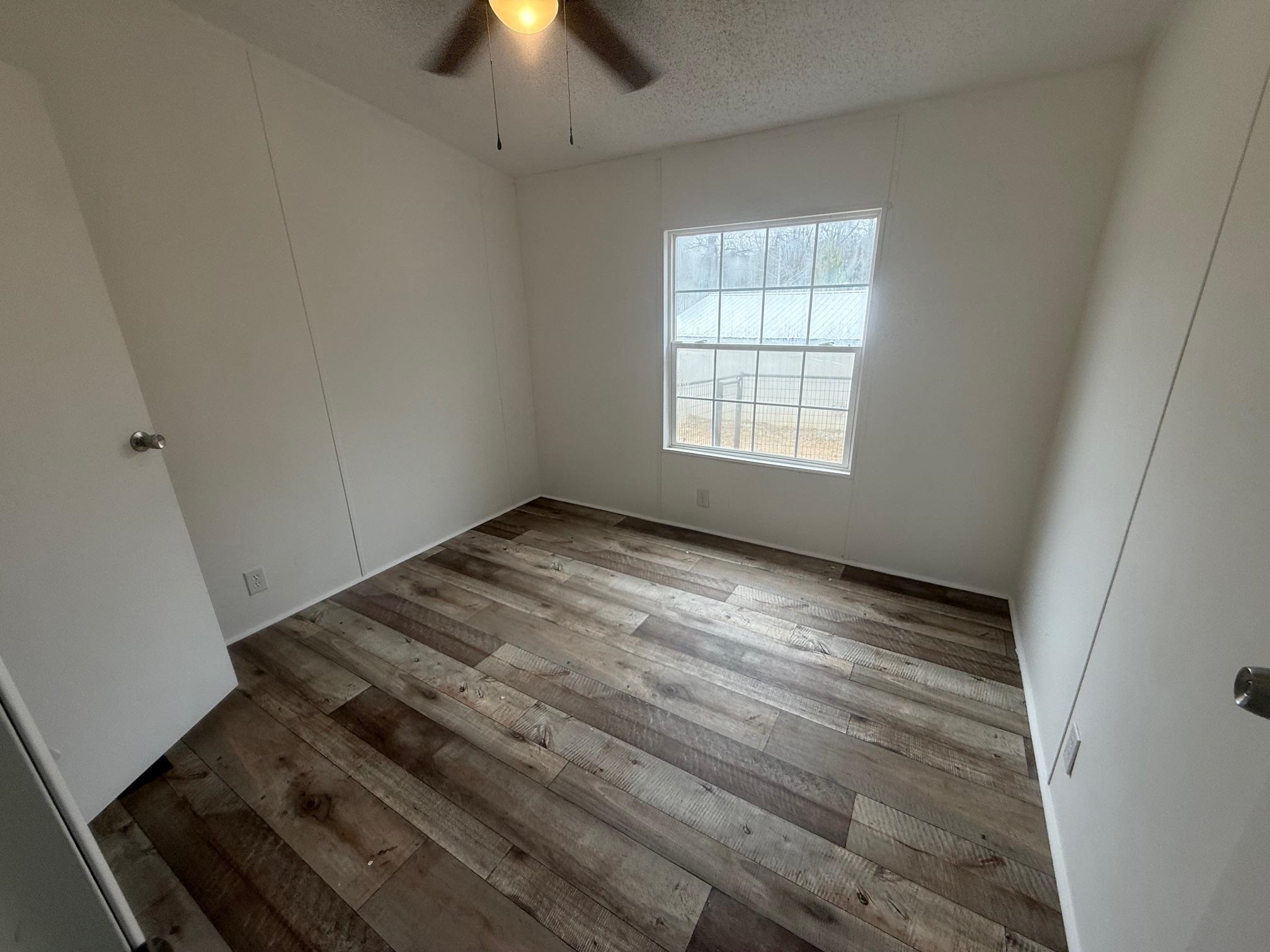 1688 Hardin Graveyard Road Adamsville, TN 38310 - Photo 19 of 40 an empty room with windows