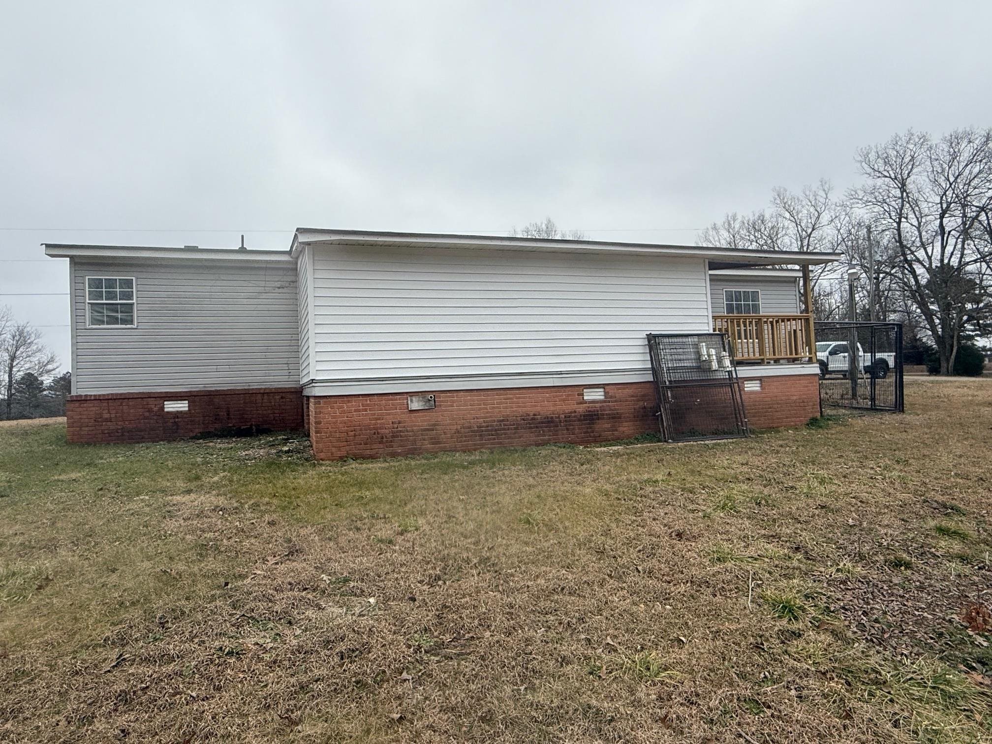 1688 Hardin Graveyard Road Adamsville, TN 38310 - Photo 40 of 40 a view of a house with backyard and barbeque oven