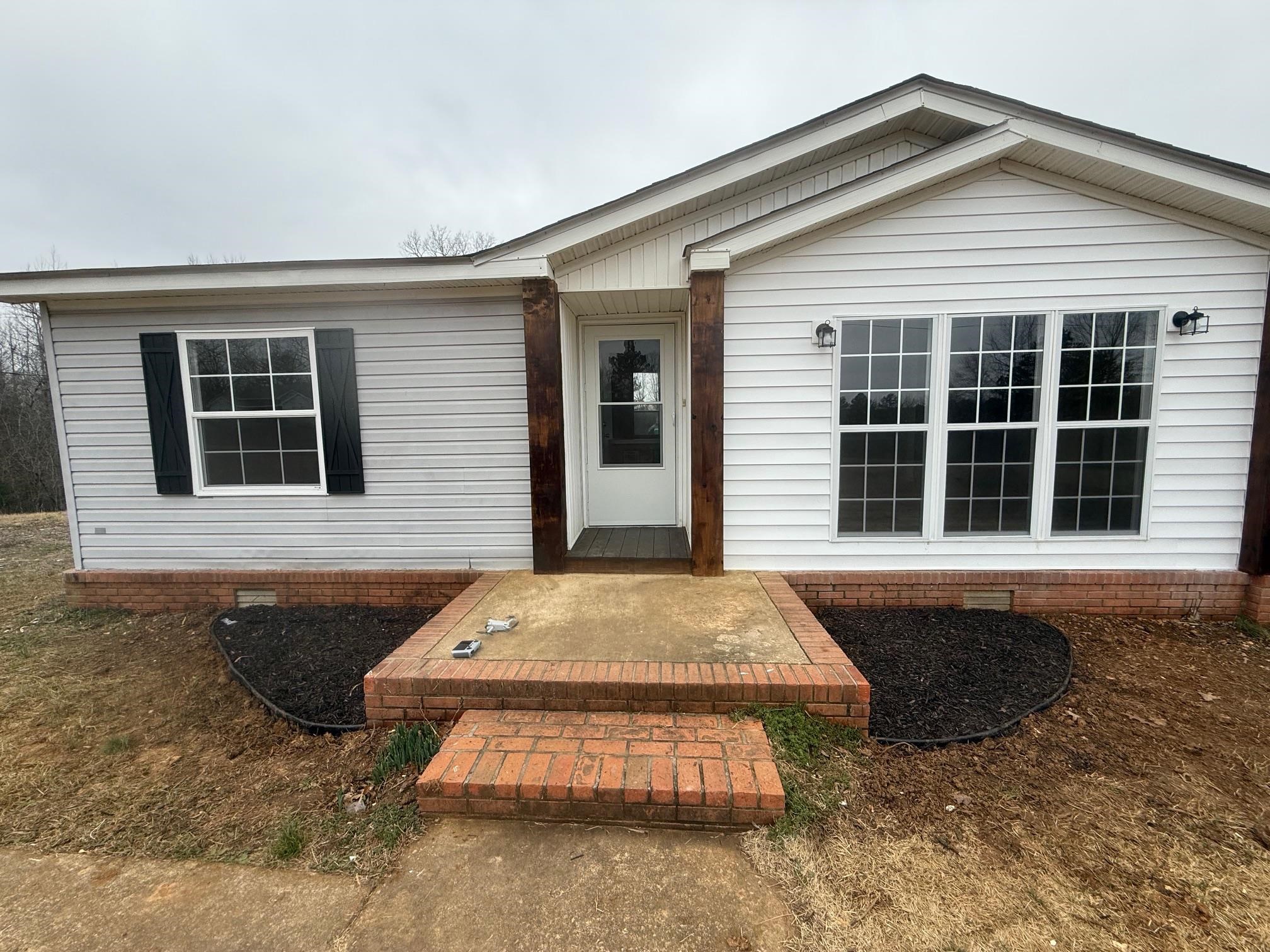 1688 Hardin Graveyard Road Adamsville, TN 38310 - Photo 5 of 40 a front view of a house with windows