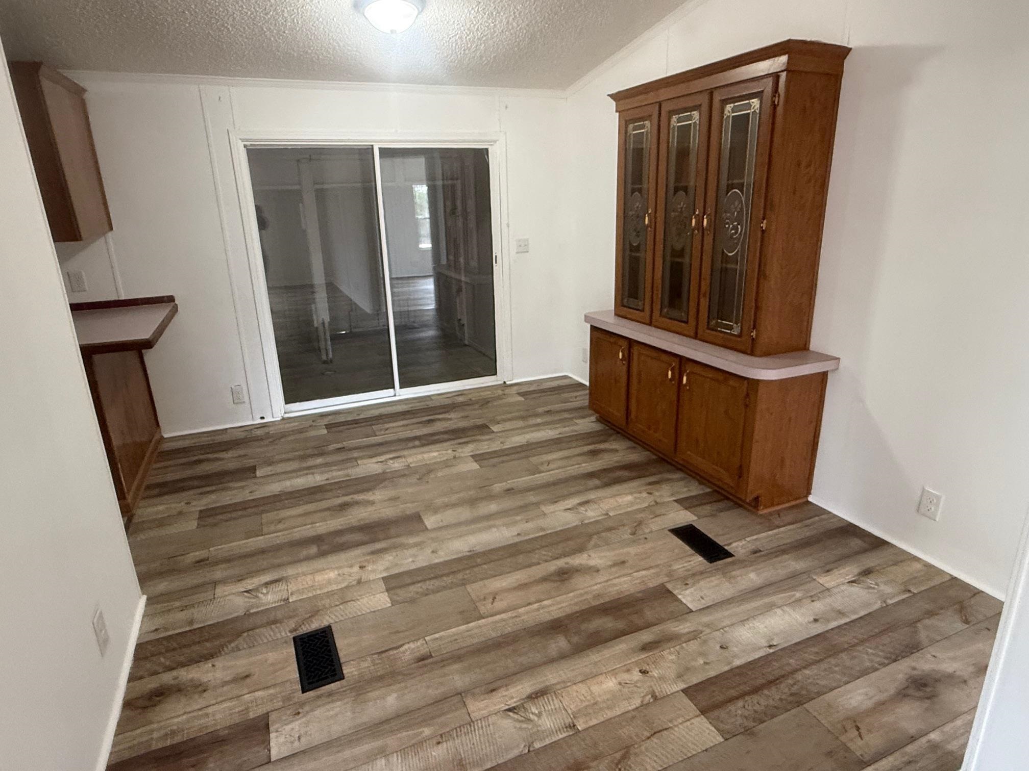 1688 Hardin Graveyard Road Adamsville, TN 38310 - Photo 8 of 40 a view of an entryway with wooden floor