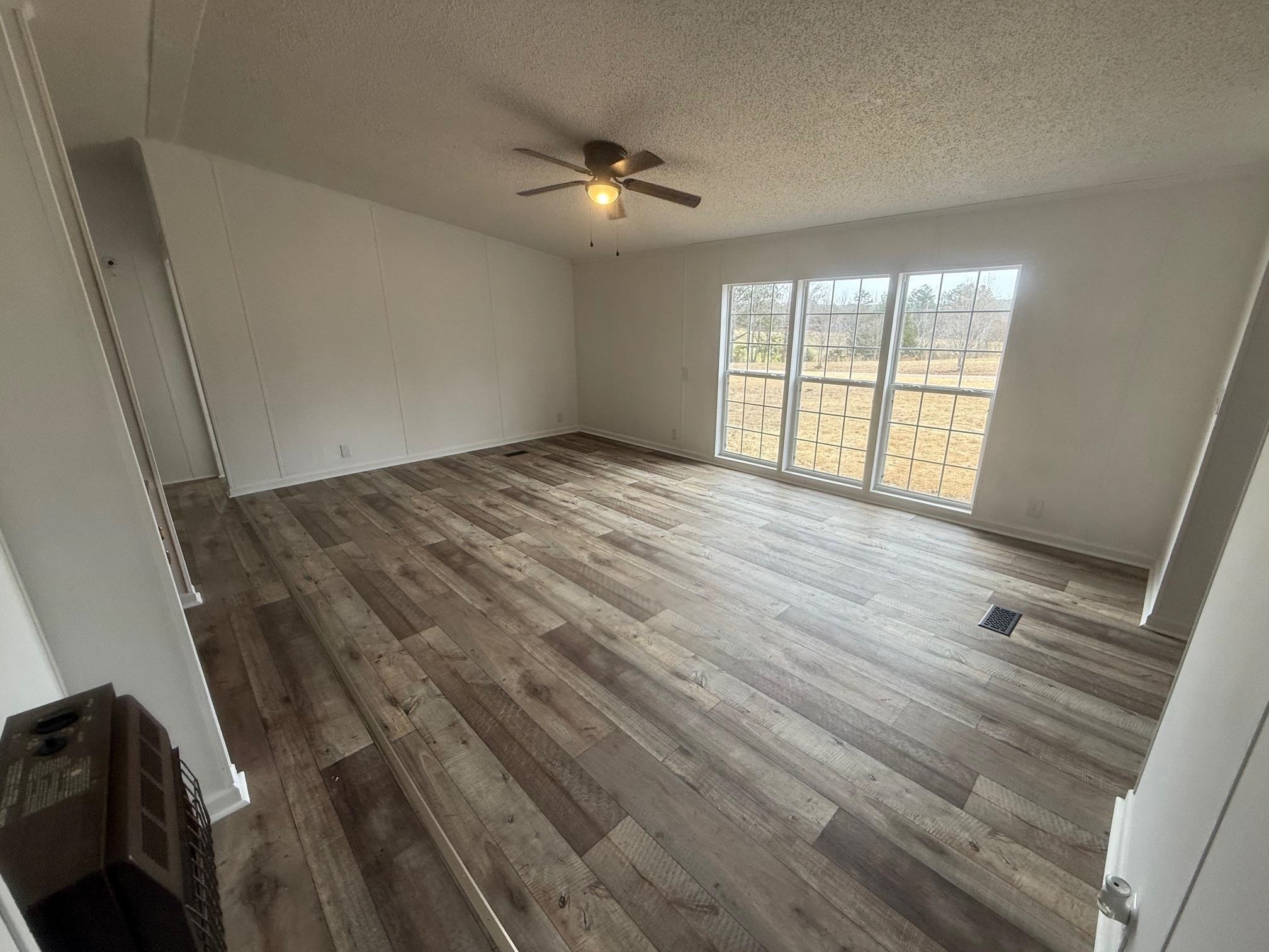 1688 Hardin Graveyard Road Adamsville, TN 38310 - Photo 10 of 40 a view of an empty room with a window