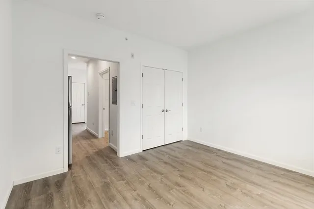 an empty room with wooden floor