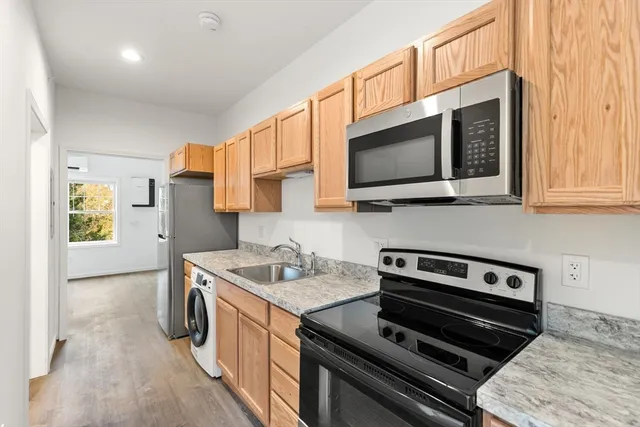 a kitchen with a stove and a microwave