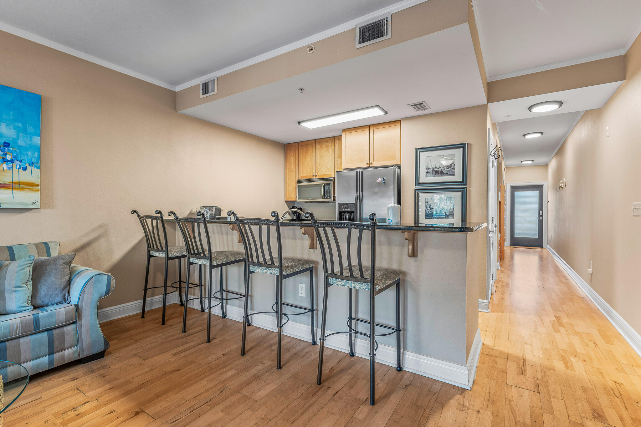 43 Cassine Way, Unit 206 Santa Rosa Beach, FL 32459 - Photo 11 of 32 a view of a dining room with furniture and wooden floor