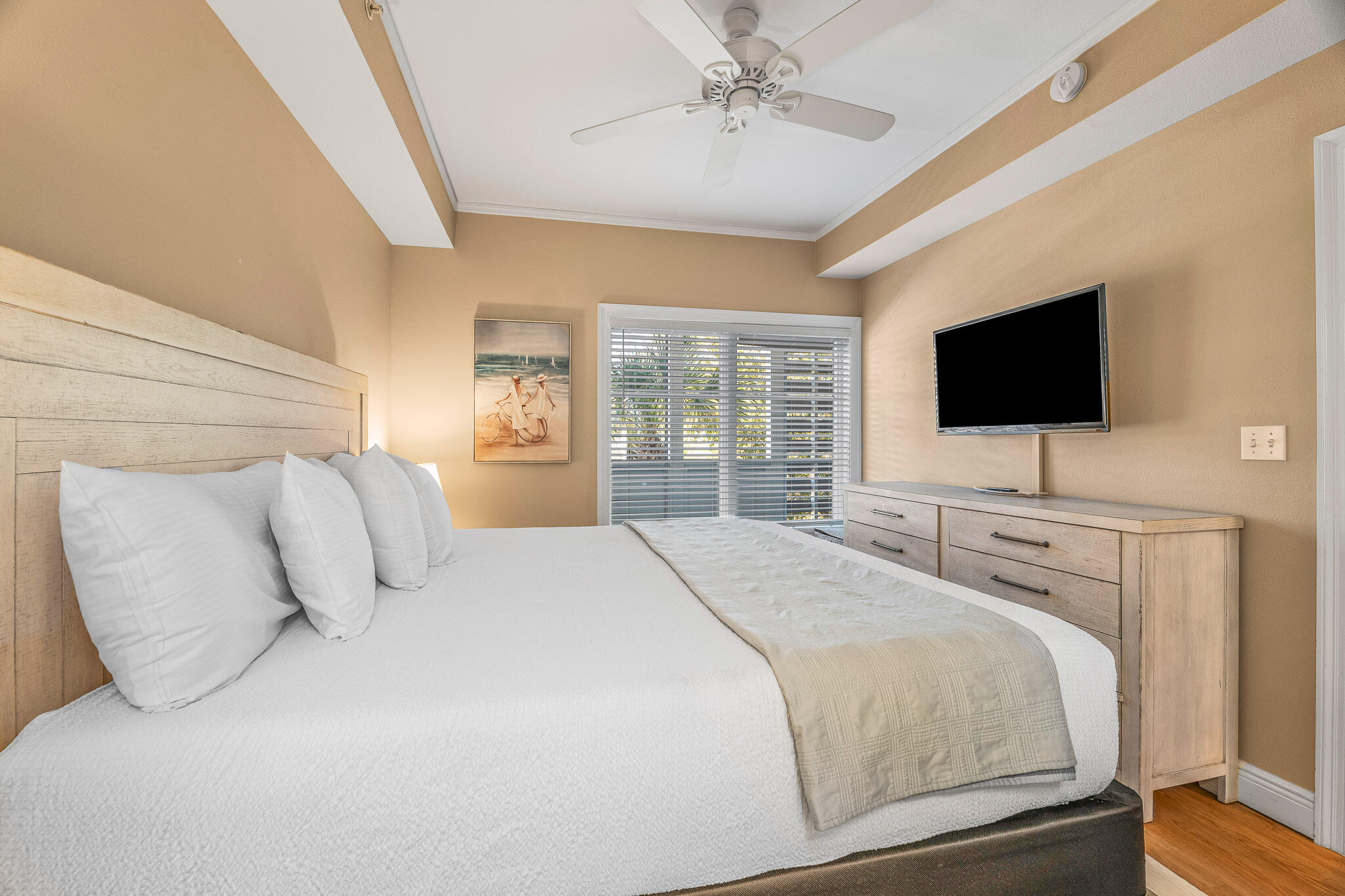 43 Cassine Way, Unit 206 Santa Rosa Beach, FL 32459 - Photo 17 of 32 a bedroom with a large bed and a flat screen tv