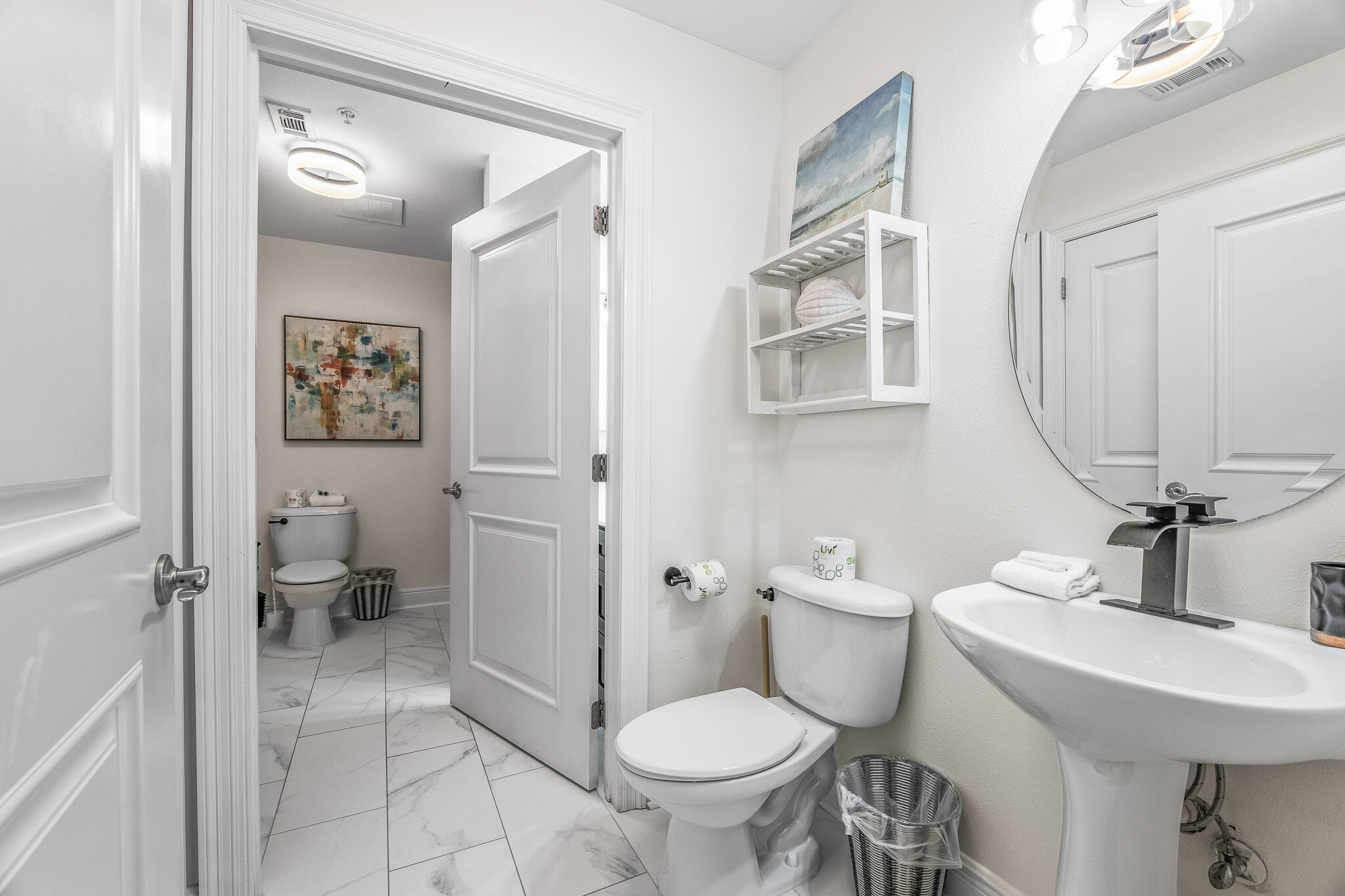 43 Cassine Way, Unit 206 Santa Rosa Beach, FL 32459 - Photo 18 of 32 a bathroom with a sink toilet and a mirror