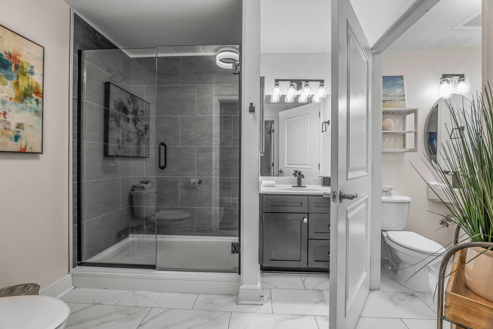 43 Cassine Way, Unit 206 Santa Rosa Beach, FL 32459 - Photo 23 of 32 a bathroom with a sink a toilet and shower