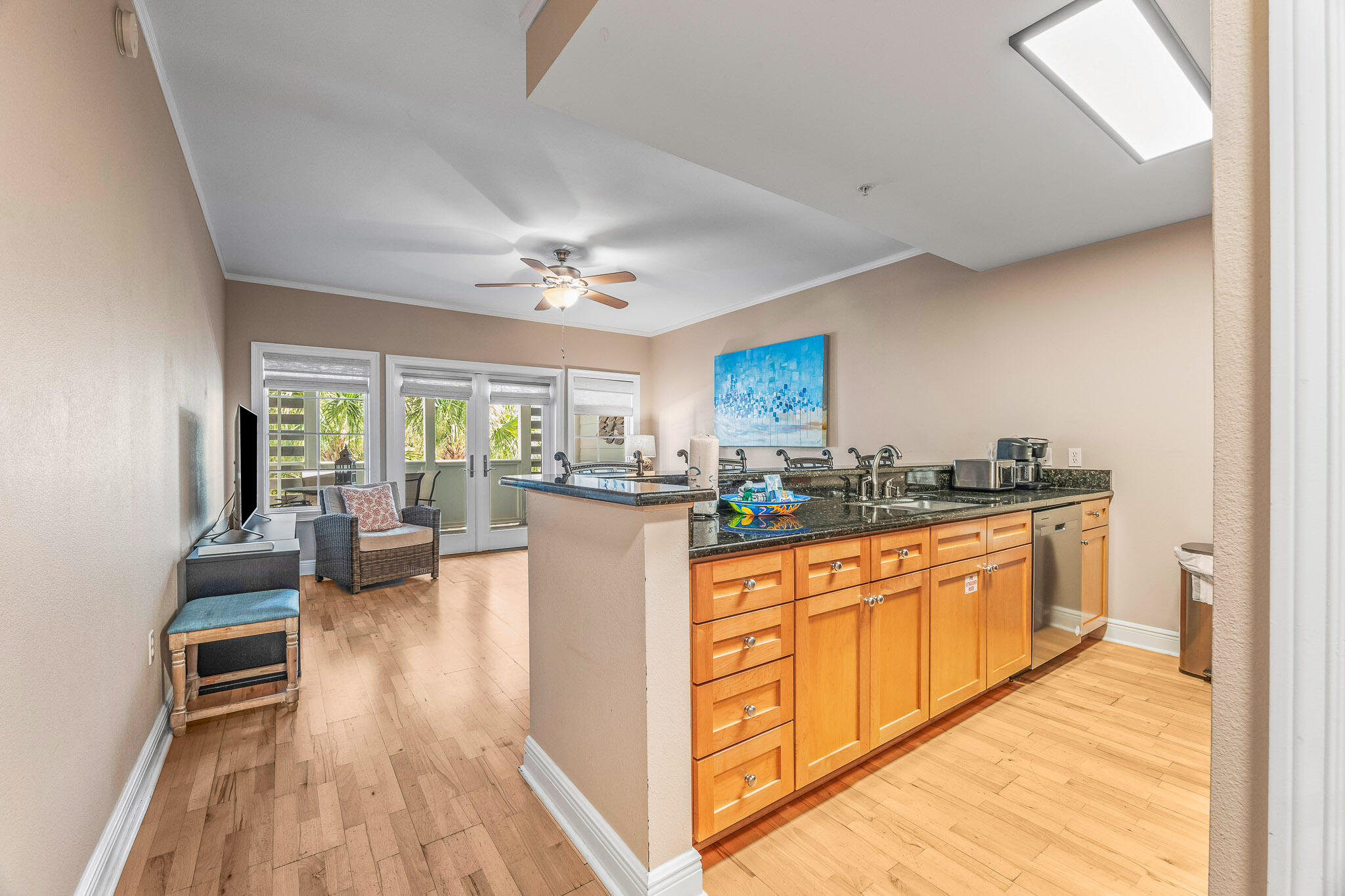 43 Cassine Way, Unit 206 Santa Rosa Beach, FL 32459 - Photo 6 of 32 a large white kitchen with granite countertop a large counter top and stainless steel appliances