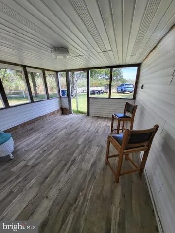 a view of a livingroom with furniture and wooden floor