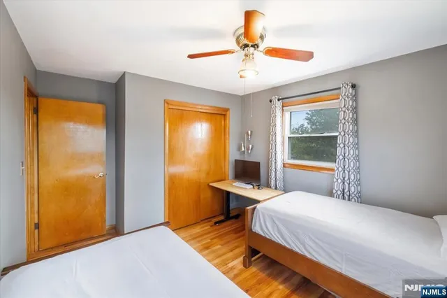 a bed room with a bed and a chandelier