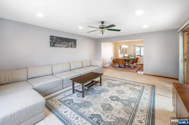 a living room with furniture and a rug
