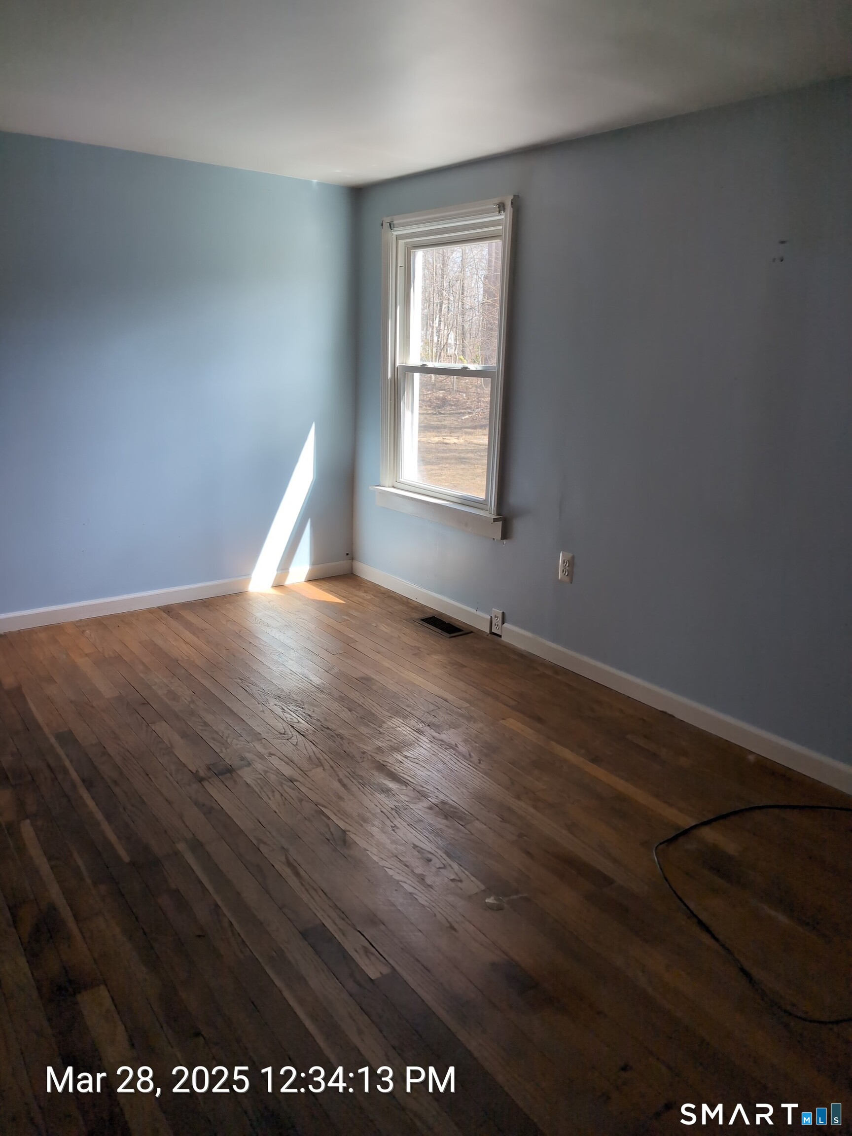 97 Bushy Hill Road Deep River, CT 06417 - Photo 22 of 28 an empty room with wooden floor and windows