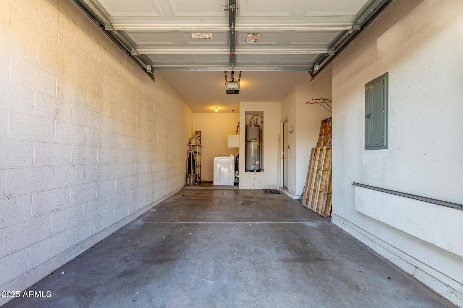 1886 East Don Carlos, Unit 147 Tempe, AZ 85281 - Photo 17 of 22 a view of a hallway with a white car parked in garage