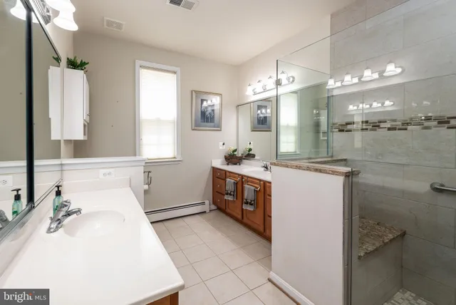 a spacious bedroom with a bed and windows