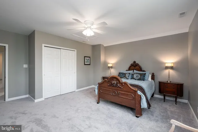 a bathroom with a sink a toilet a shower and a mirror