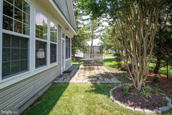 a view of a house with yard and a garden