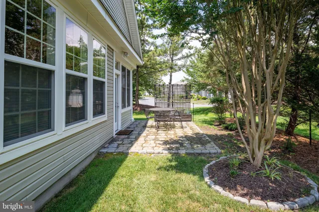 a view of a house with yard and a garden