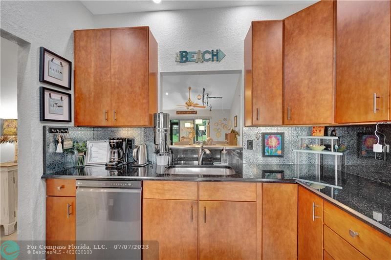 10999 Water Oak Manor Boca Raton, FL 33498 - Photo 13 of 49 a kitchen with stainless steel appliances sink refrigerator and cabinets