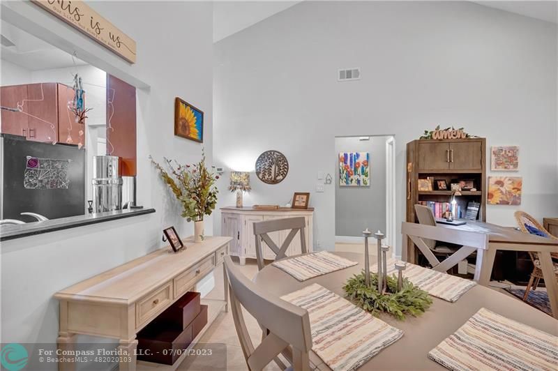 10999 Water Oak Manor Boca Raton, FL 33498 - Photo 18 of 49 a living room with furniture and a kitchen view