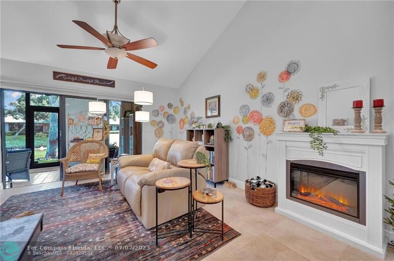10999 Water Oak Manor Boca Raton, FL 33498 - Photo 20 of 49 a living room with furniture and a fireplace