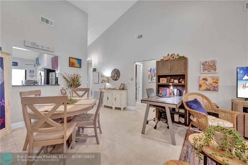 10999 Water Oak Manor Boca Raton, FL 33498 - Photo 21 of 49 a living room with furniture a rug and a bookshelf