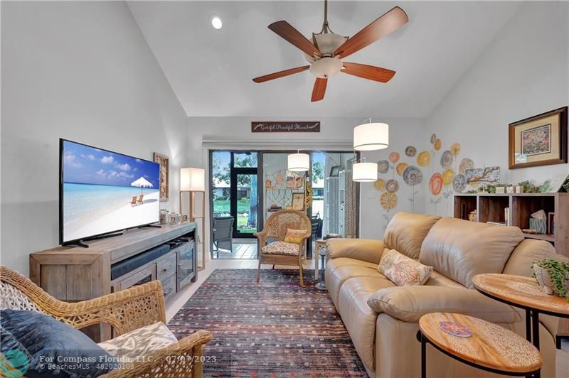10999 Water Oak Manor Boca Raton, FL 33498 - Photo 22 of 49 a living room with furniture and a flat screen tv