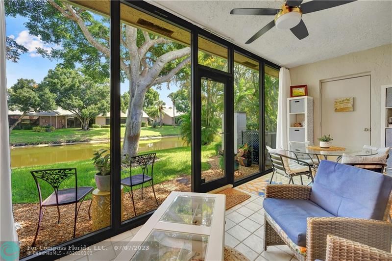 10999 Water Oak Manor Boca Raton, FL 33498 - Photo 25 of 49 a living room with patio furniture and garden