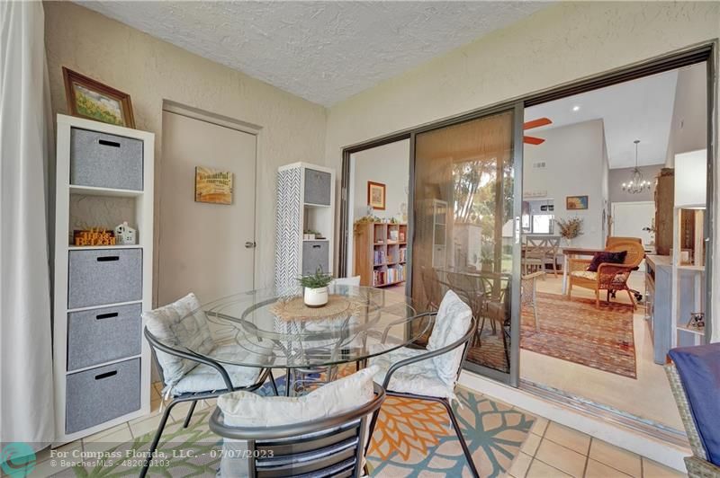 10999 Water Oak Manor Boca Raton, FL 33498 - Photo 27 of 49 a dining room with furniture and window