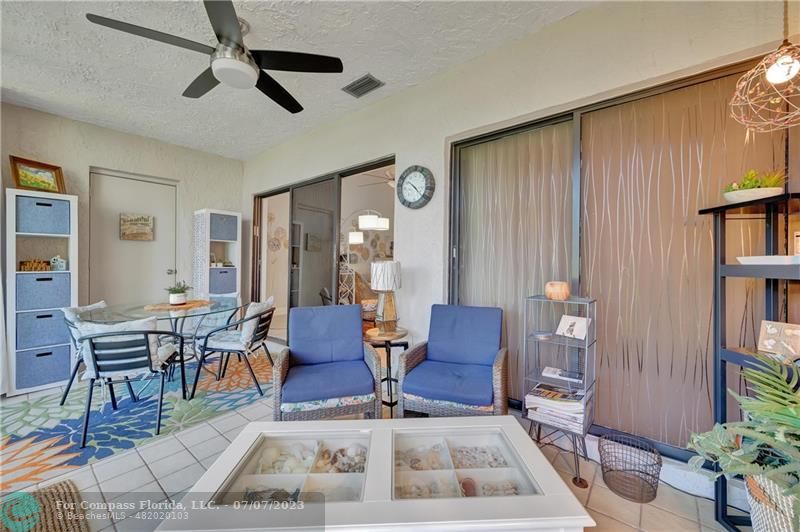 10999 Water Oak Manor Boca Raton, FL 33498 - Photo 28 of 49 a living room with furniture and a window