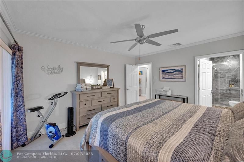 10999 Water Oak Manor Boca Raton, FL 33498 - Photo 30 of 49 a bedroom with a bed and a window