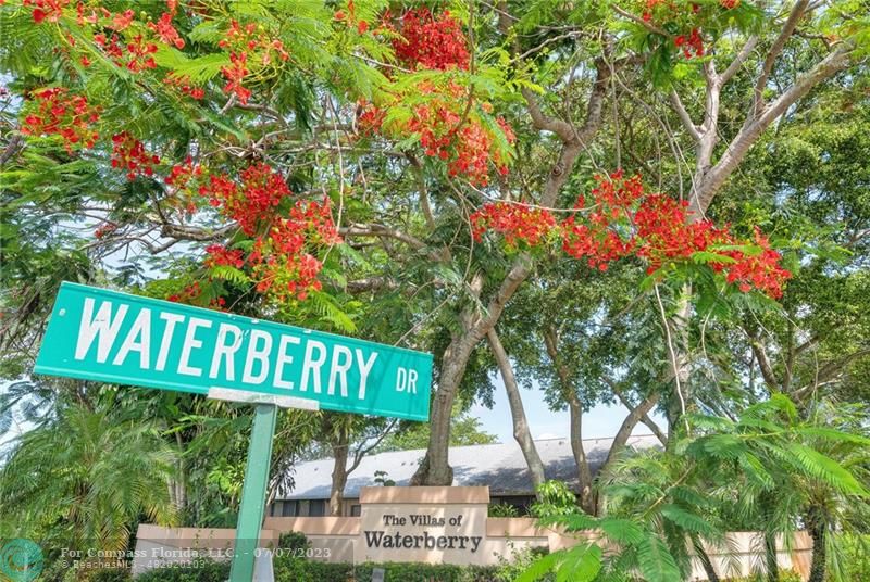 10999 Water Oak Manor Boca Raton, FL 33498 - Photo 4 of 49 a street sign that is sitting in a yard