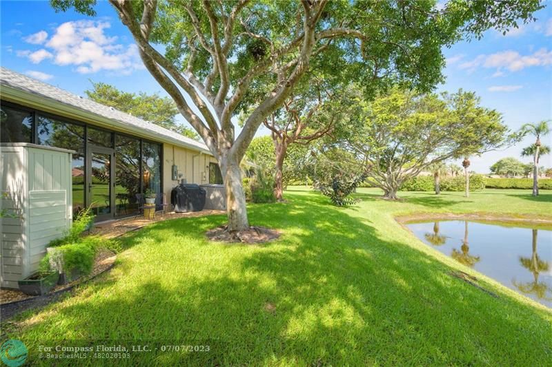10999 Water Oak Manor Boca Raton, FL 33498 - Photo 41 of 49 a view of a house with a yard
