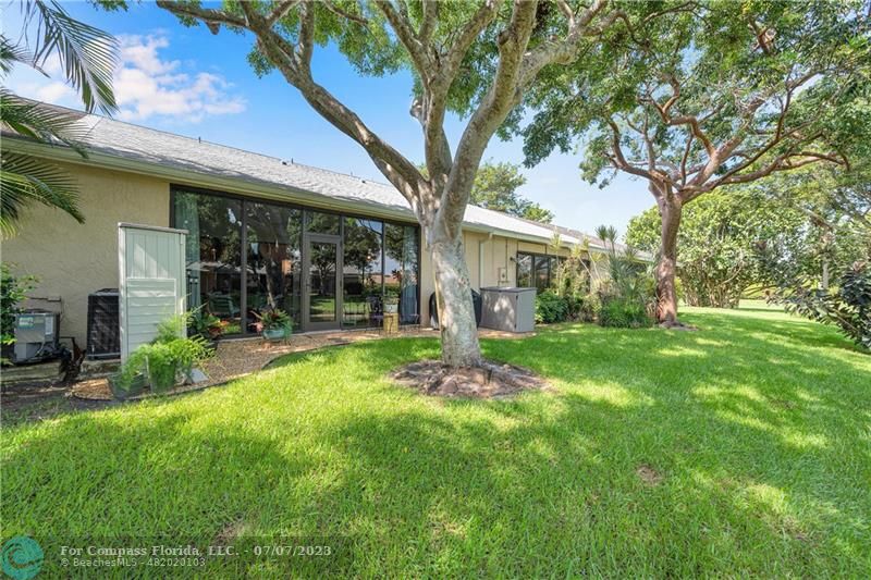 10999 Water Oak Manor Boca Raton, FL 33498 - Photo 44 of 49 a view of a house with backyard porch and garden