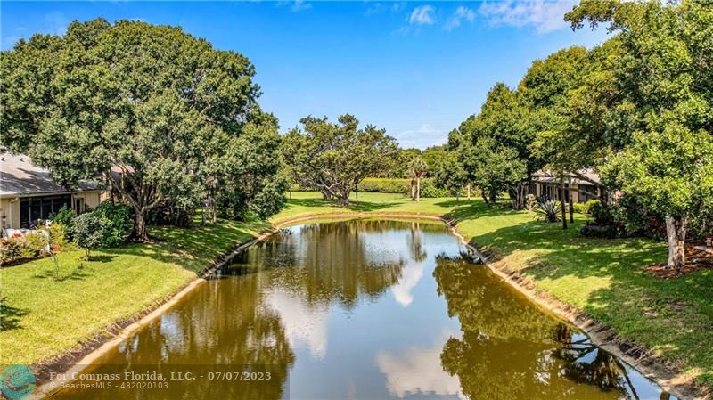 10999 Water Oak Manor Boca Raton, FL 33498 - Photo 45 of 49 a view of a swimming pool with a yard