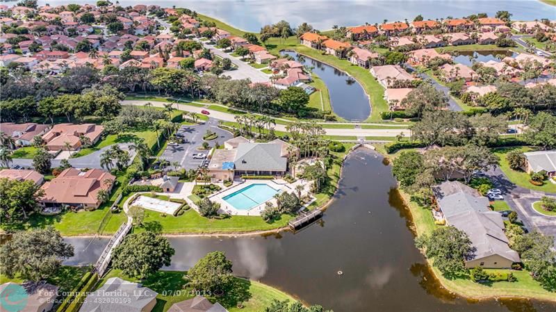 10999 Water Oak Manor Boca Raton, FL 33498 - Photo 46 of 49 an aerial view of residential houses with outdoor space