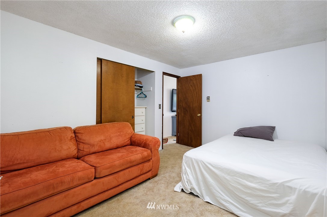 2734 Pine Road Northeast Bremerton, WA 98310 - Photo 12 of 17 a bedroom with bed couch and a window
